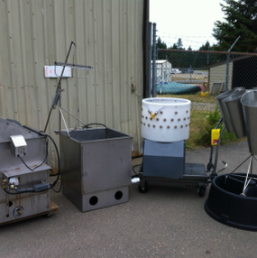 poultry processing equipment next to a grey shed